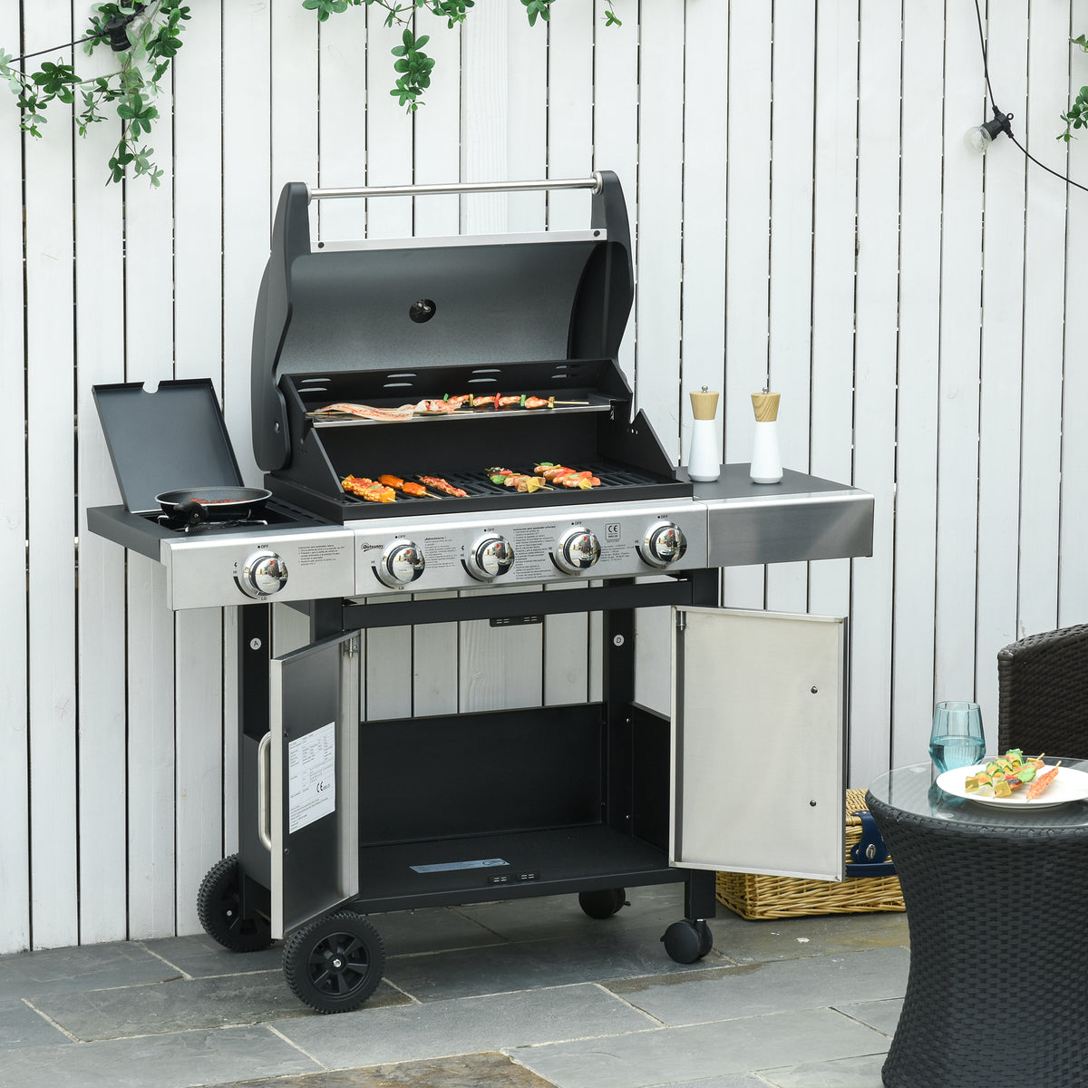 Churrasqueira a Gás com Rodas grelha com 4 + 1 Queimadores 3 KW Mesa Lateral Armário de Armazenamento em Aço Inoxidável 128x50x113 cm Preto Prateado — foto 2